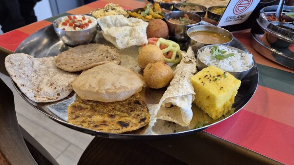 A thali in a restaurant, bowls of indian food