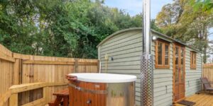 Wood fired jacuzzi outside Stoughton Grange accommodation hut
