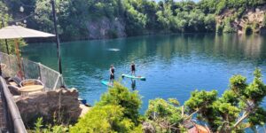 Two people on paddleboards in a lake