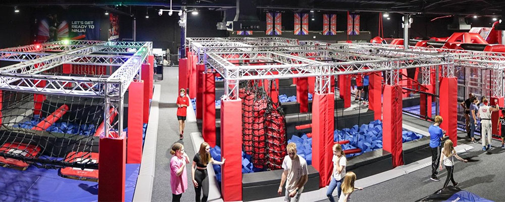 a ninja warrior course with children walking around