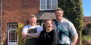 a portrait of 3 people who run a restaurant