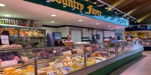 A market stall selling cheese and meat
