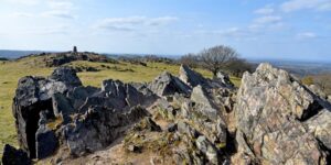 a rocky outcrop on a large hill