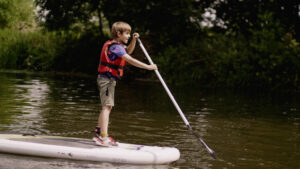 A Child on a paddleboard