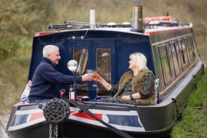 canal boat with two people on