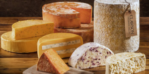 cheese wheels on a board