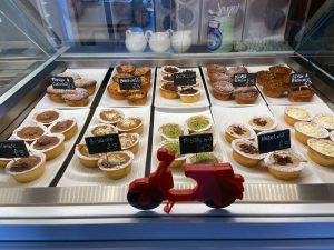 cakes and pastries on a deli counter
