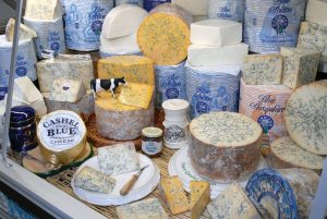mixed cheese wheels on a table