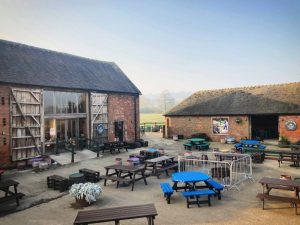 exterior of farm shop with seating