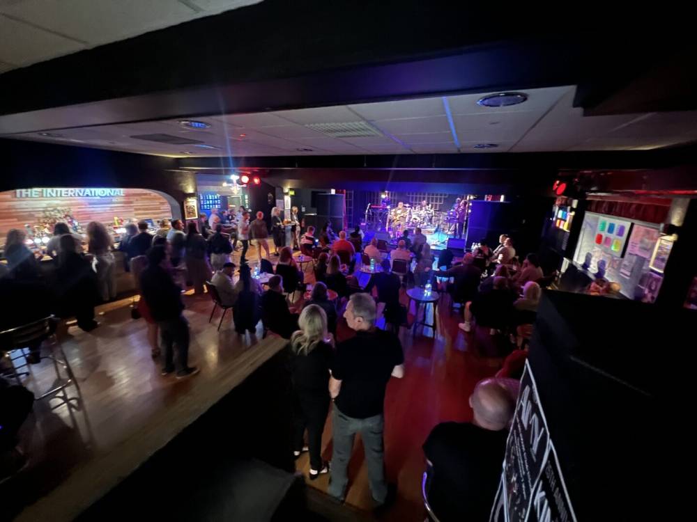 A crowd watching a band at The International
