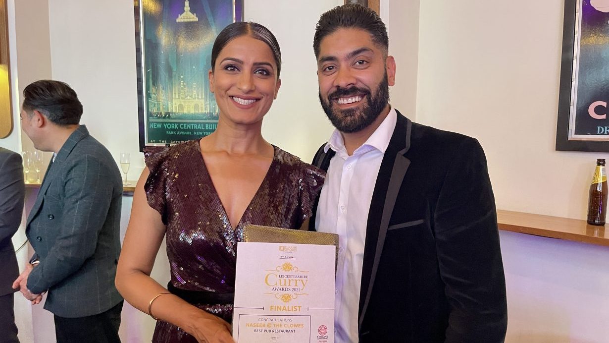 Representatives from Naseeb at The Cloves holding their certificate