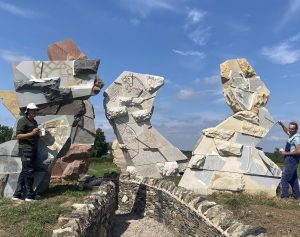 Sculptors apply the finishing touches to the Storm Breaks