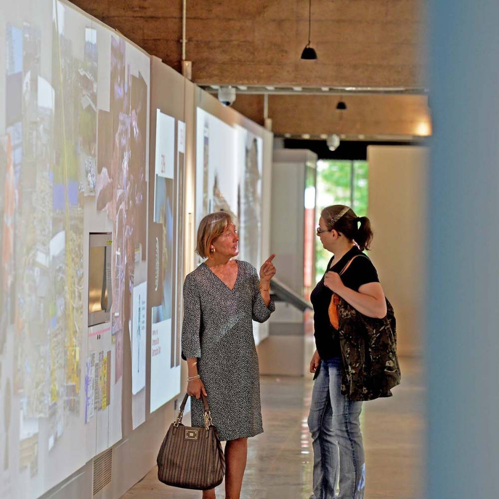 People talking in the Jewry Wall Museum