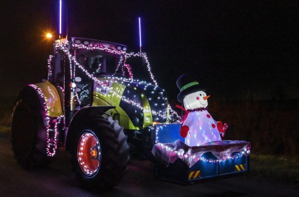 A tractor with festive lights