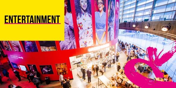 Entertainment text over the Interior of a theatre