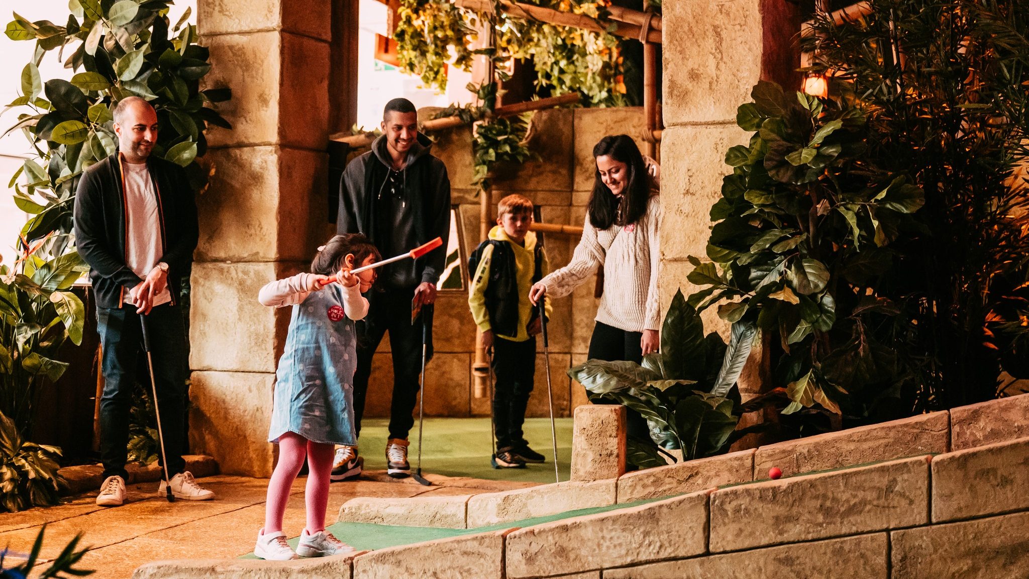 A family at Treetop adventure golf