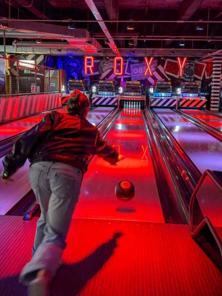 A girl bowling at Roxy Ballroom