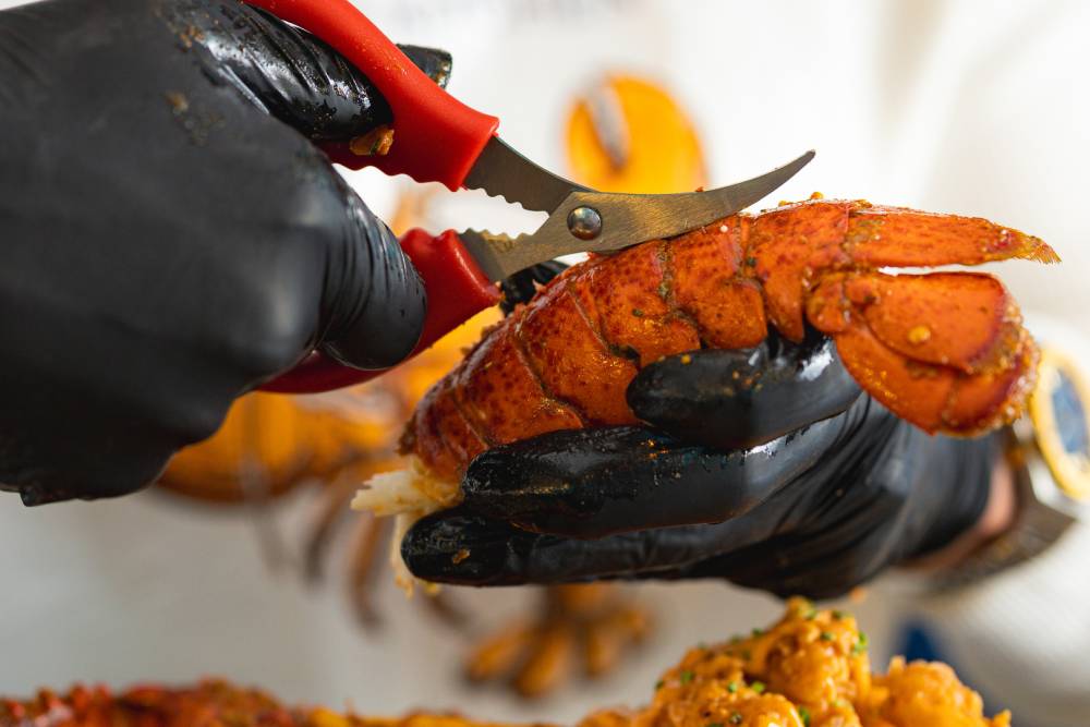 Cutting a lobster at Sapphire Seafood Kitchen