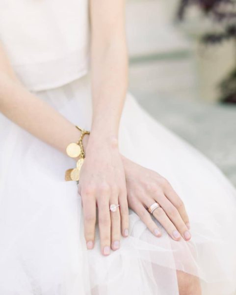 A lady wearing rings and bracelets