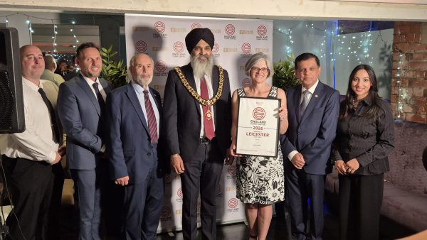 Dignitaries receiving the Curry Capital award on behalf of Leicester