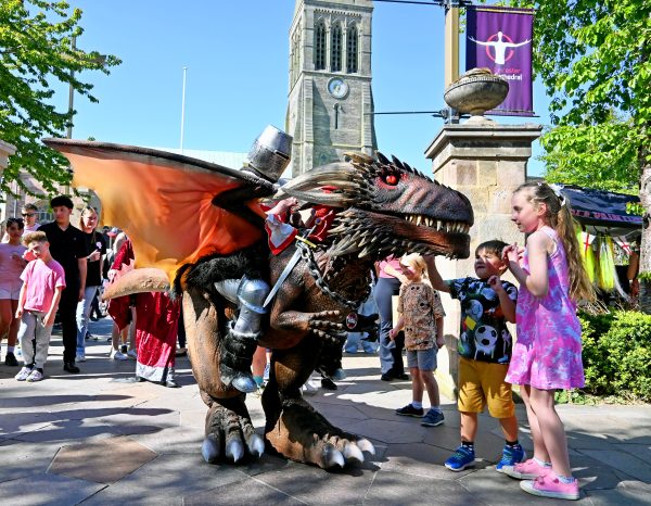 Kids meeting a dragon at the Old Town Festival