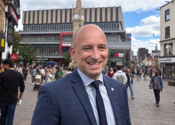 man standing in city centre