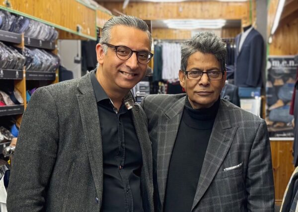 Two men in a suit shop